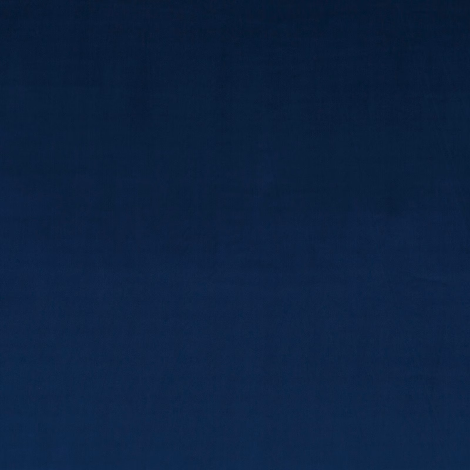 Deep indigo velvet with subtle nap shading and a soft, plain surface