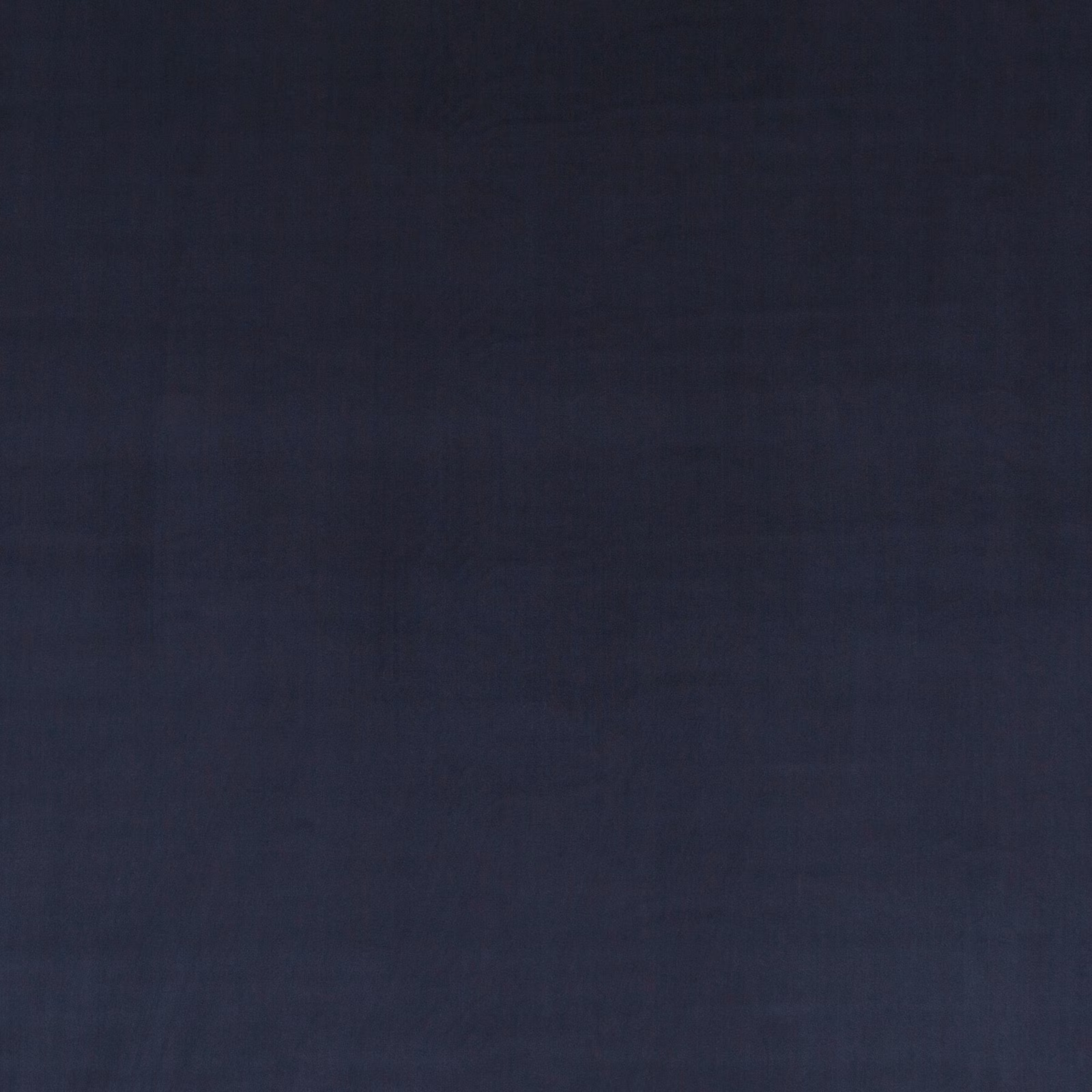 Deep midnight blue velvet with subtle blue-black tonal shifts across its soft pile