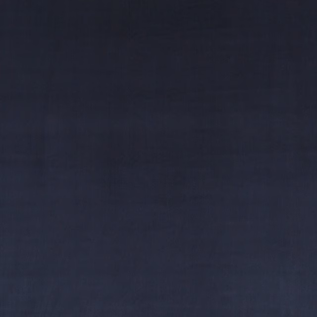 Deep midnight blue velvet with subtle blue-black tonal shifts across its soft pile