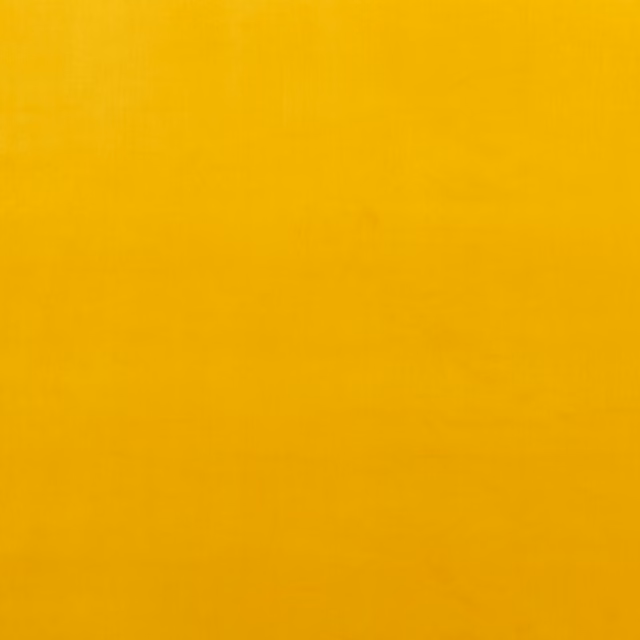 Warm ochre-yellow plain velvet showing subtle directional nap and tonal shading