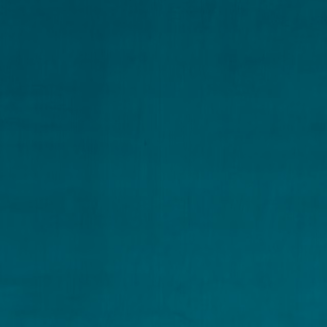 Close-up of deep peacock teal velvet showing a smooth, subtly directional pile