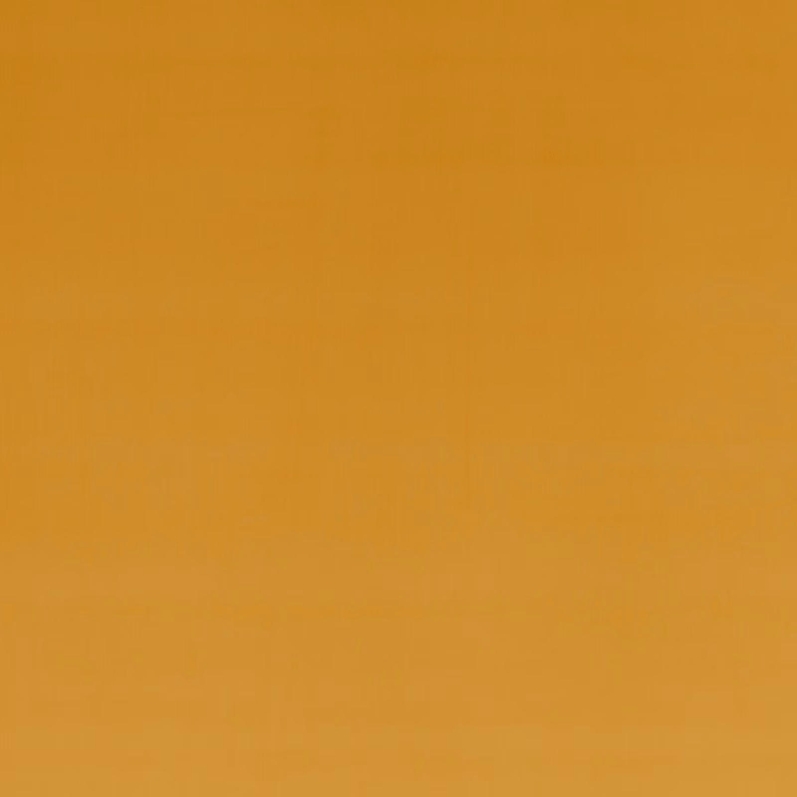 Close-up of warm sienna-orange velvet with a softly shaded, smooth pile
