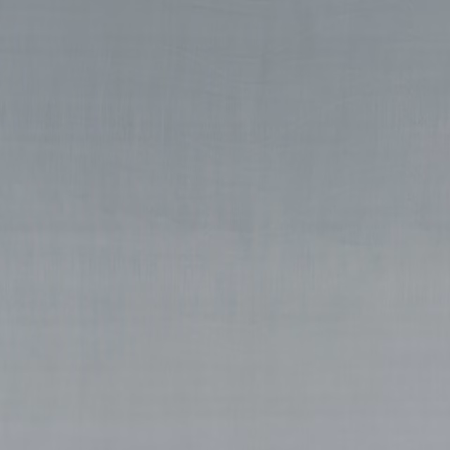 Soft blue-grey plain velvet showing subtle vertical nap and tonal light variation