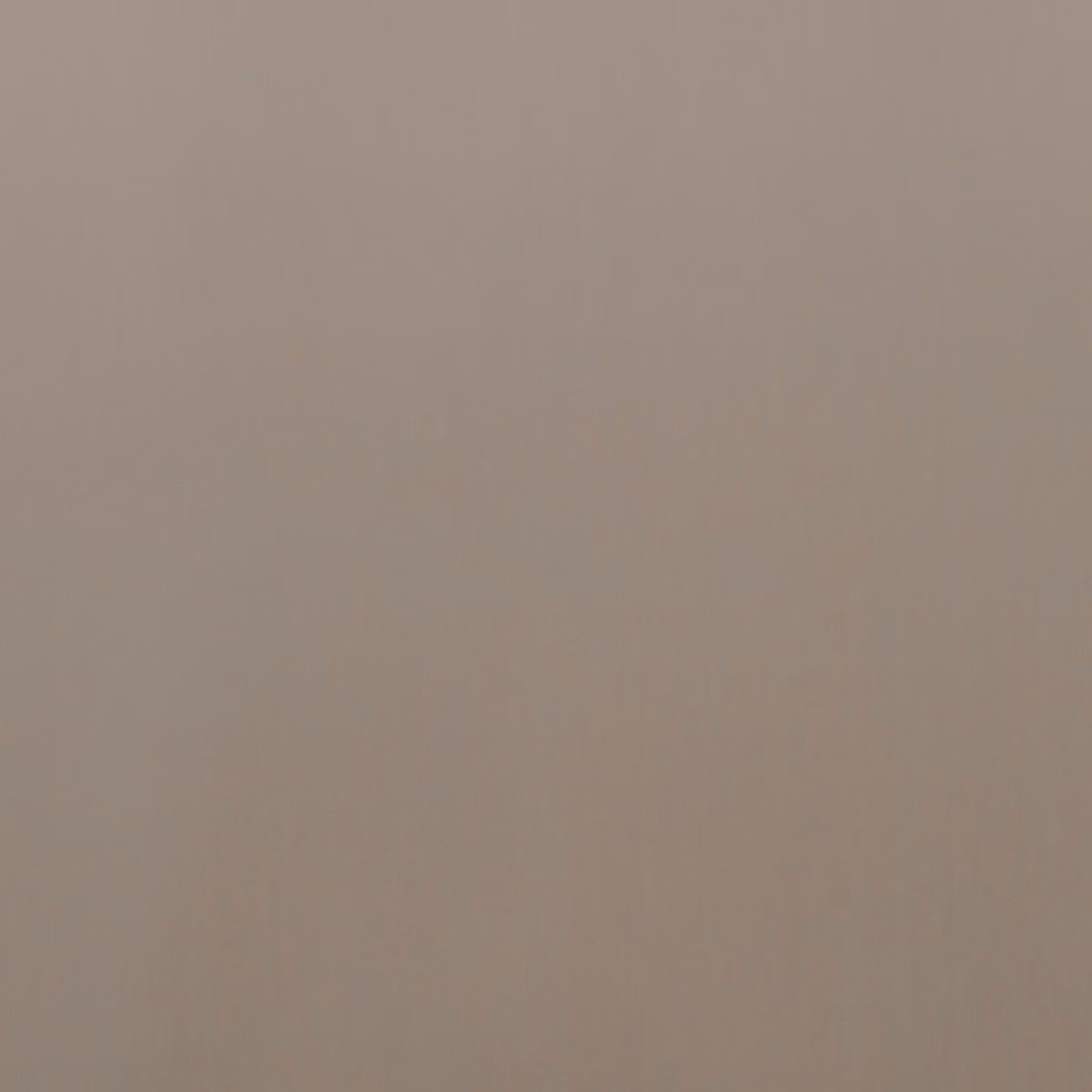 Close-up of plain warm taupe velvet with softly shifting vertical pile texture