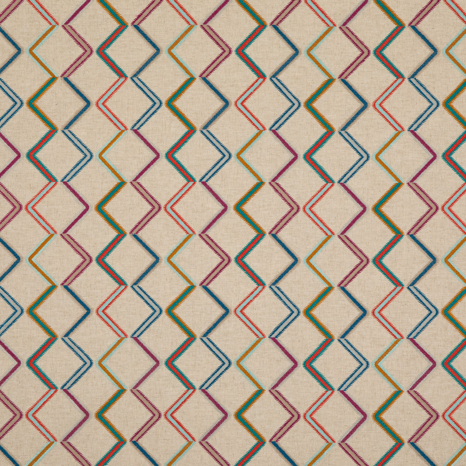 Cream woven ground with multicoloured outlined diamond and zigzag motifs