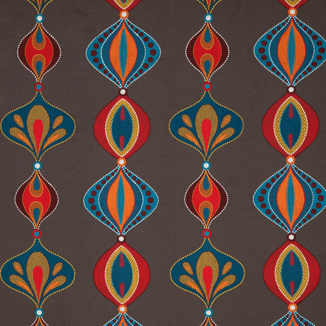 Teal and spice geometric floral motifs on a charcoal-brown patterned fabric