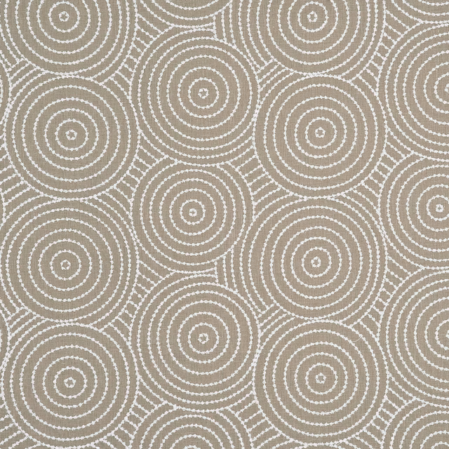 Warm taupe fabric with ivory concentric circles and woven geometric texture