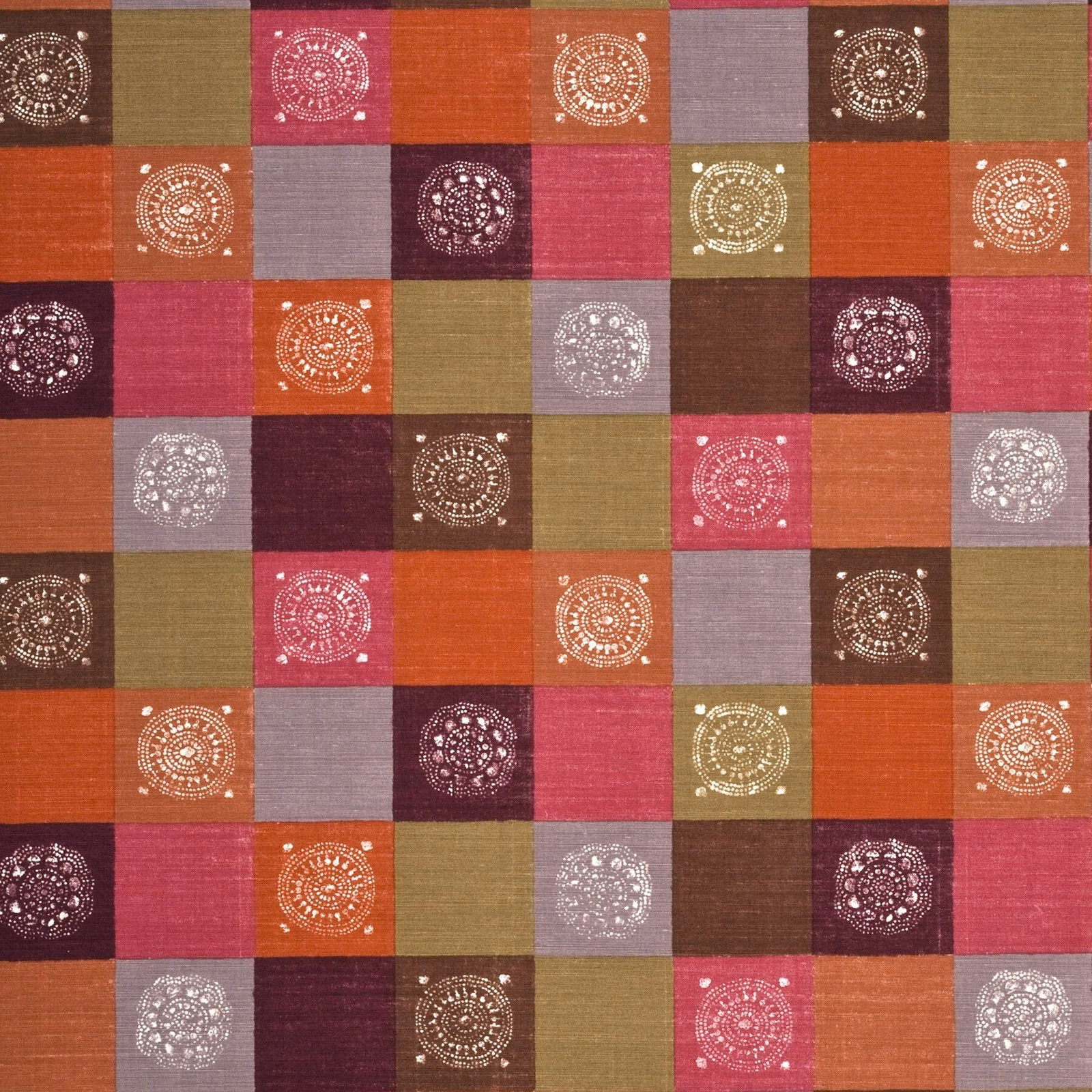 Sienna, fuchsia and olive patchwork squares with white circular medallions