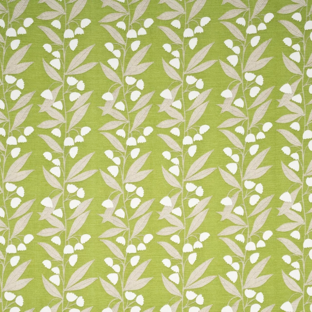 Lime-green woven fabric with white bell flowers and pale blush leaves