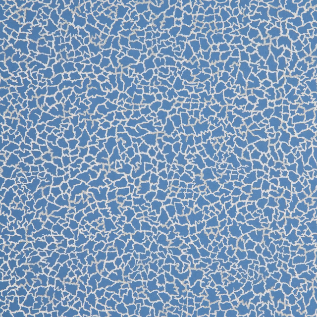 Cobalt blue wallpaper with a dense ivory, branching crackle pattern