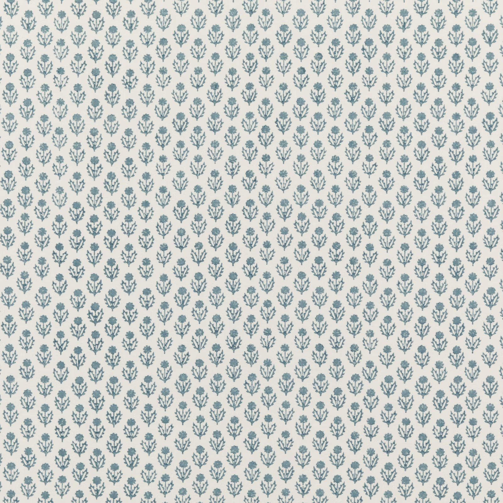 Soft blue botanical sprigs in a small repeat on a cream cotton ground