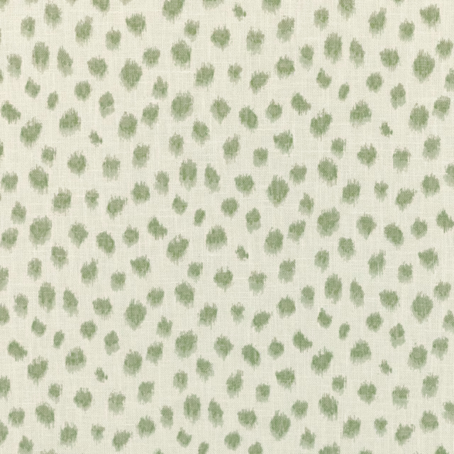 Soft sage-green flecks scattered across a cream woven Lyme Green fabric