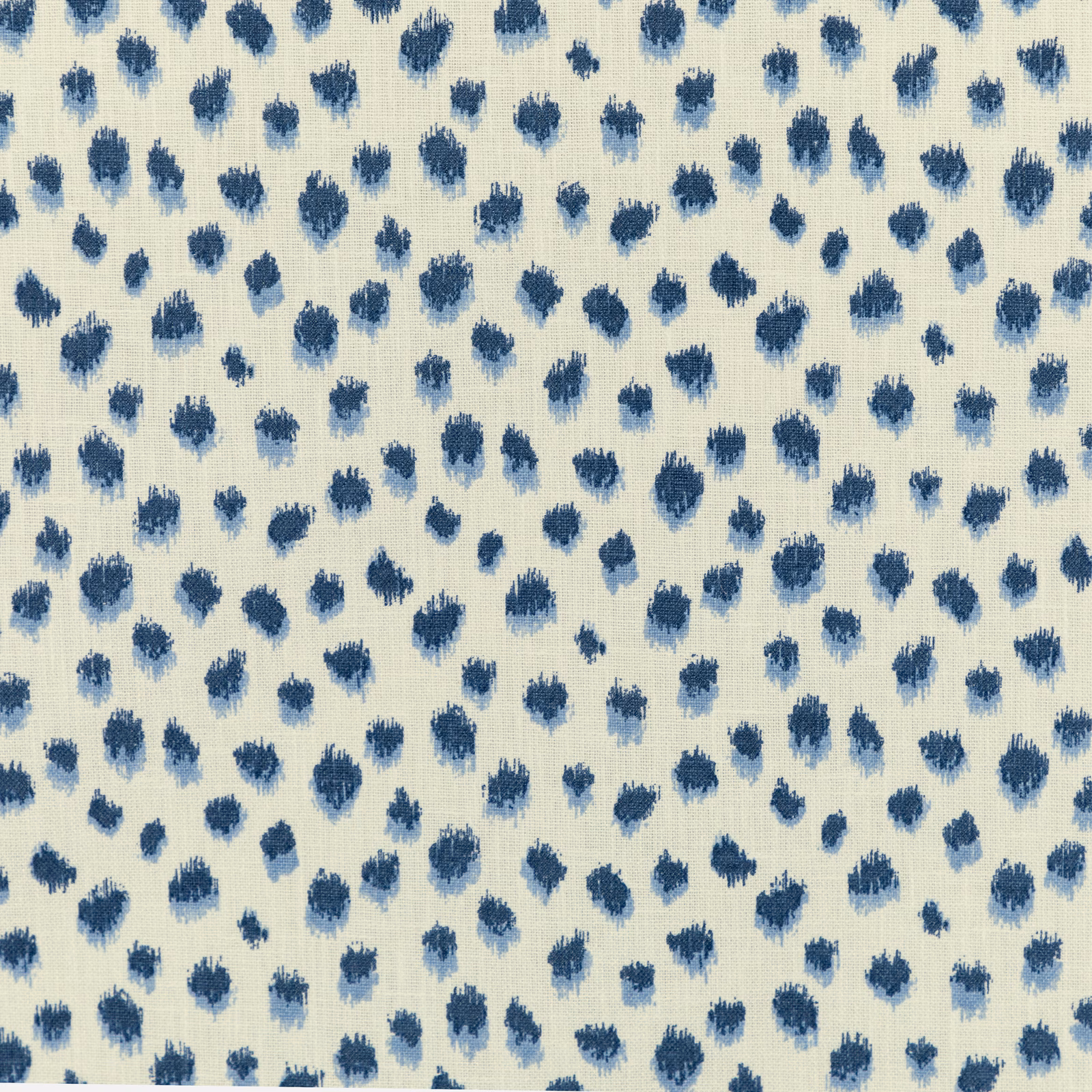 Cream woven fabric with scattered indigo brush-mark motifs and fine vertical texture