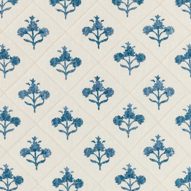 Ivory fabric with repeated muted indigo flowering stems and faint diamond lattice