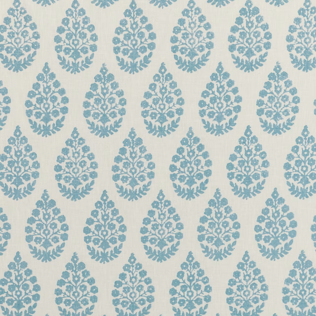 Pale aqua fabric with repeated blue floral damask medallions and fine woven grain