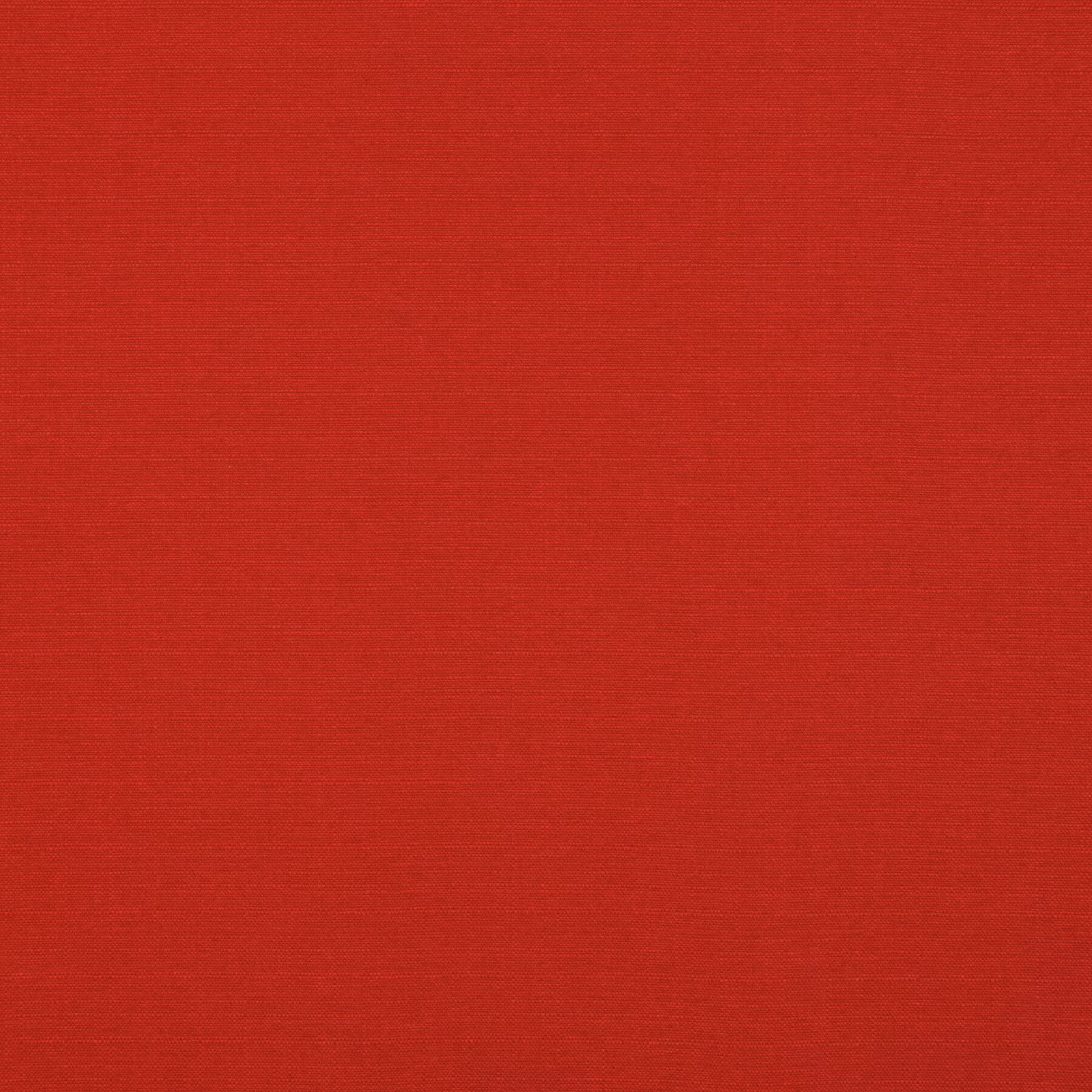 Close-up of saturated pillar-box red fabric with a fine horizontal woven texture