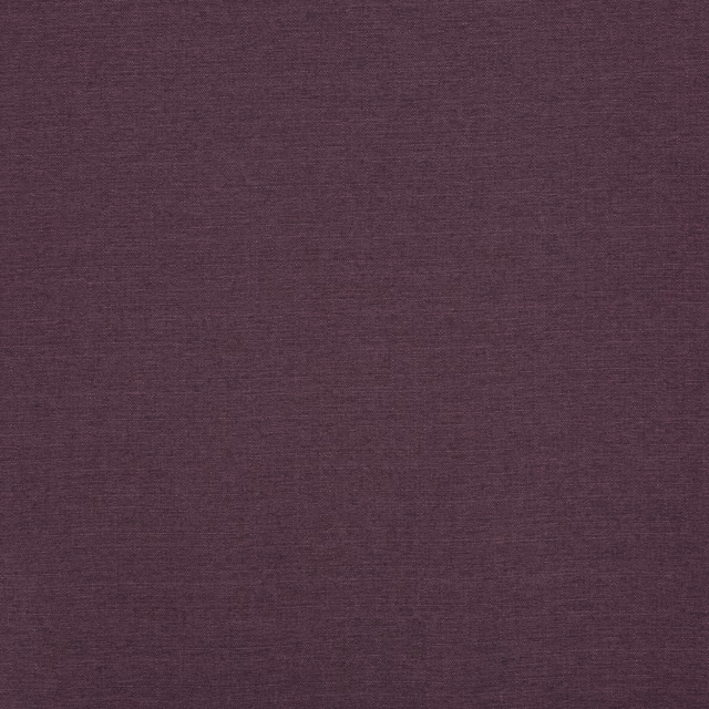 Close view of deep plum fabric with a fine, subtly varied woven texture