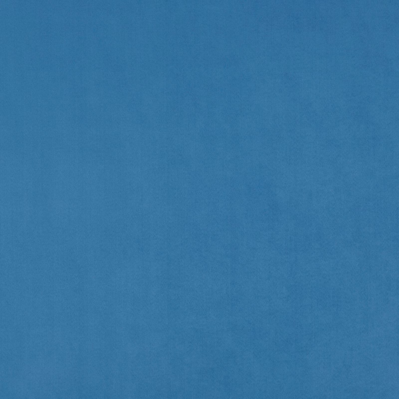 Close-up of subtly mottled deep marine blue fabric with a soft woven surface