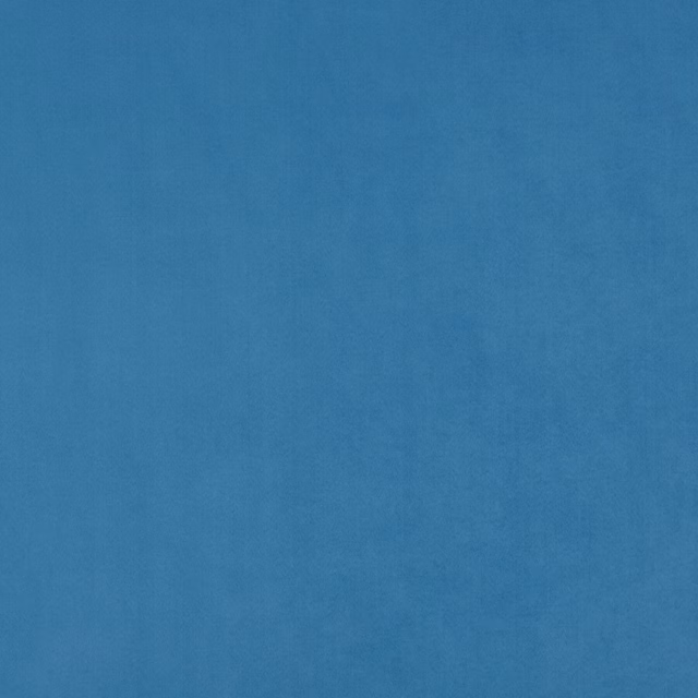 Close-up of subtly mottled deep marine blue fabric with a soft woven surface