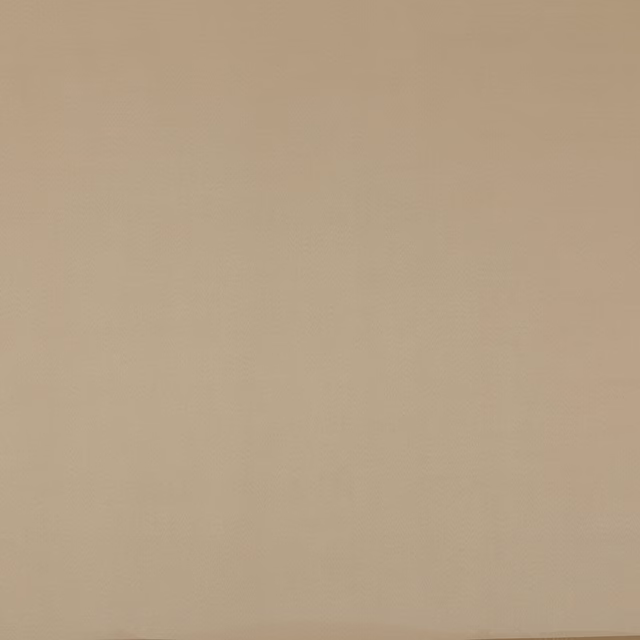 Warm sand-beige textile with a smooth, subtly tonal woven surface