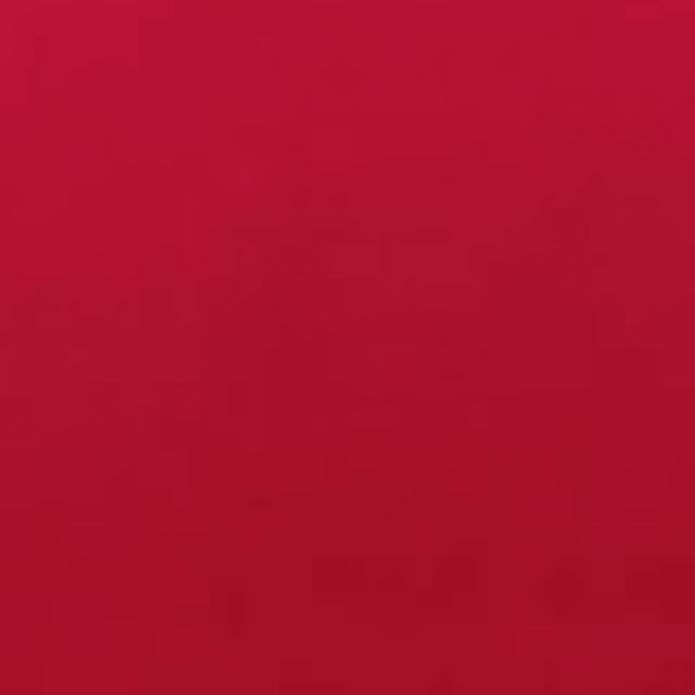 Deep raspberry-red fabric showing a smooth, subtly textured solid surface