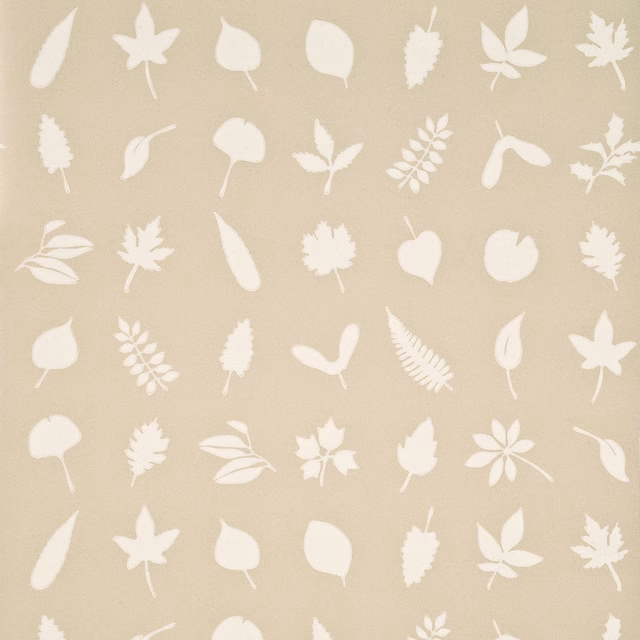 Warm linen-beige wallpaper with scattered ivory leaf silhouettes and subtle paper grain