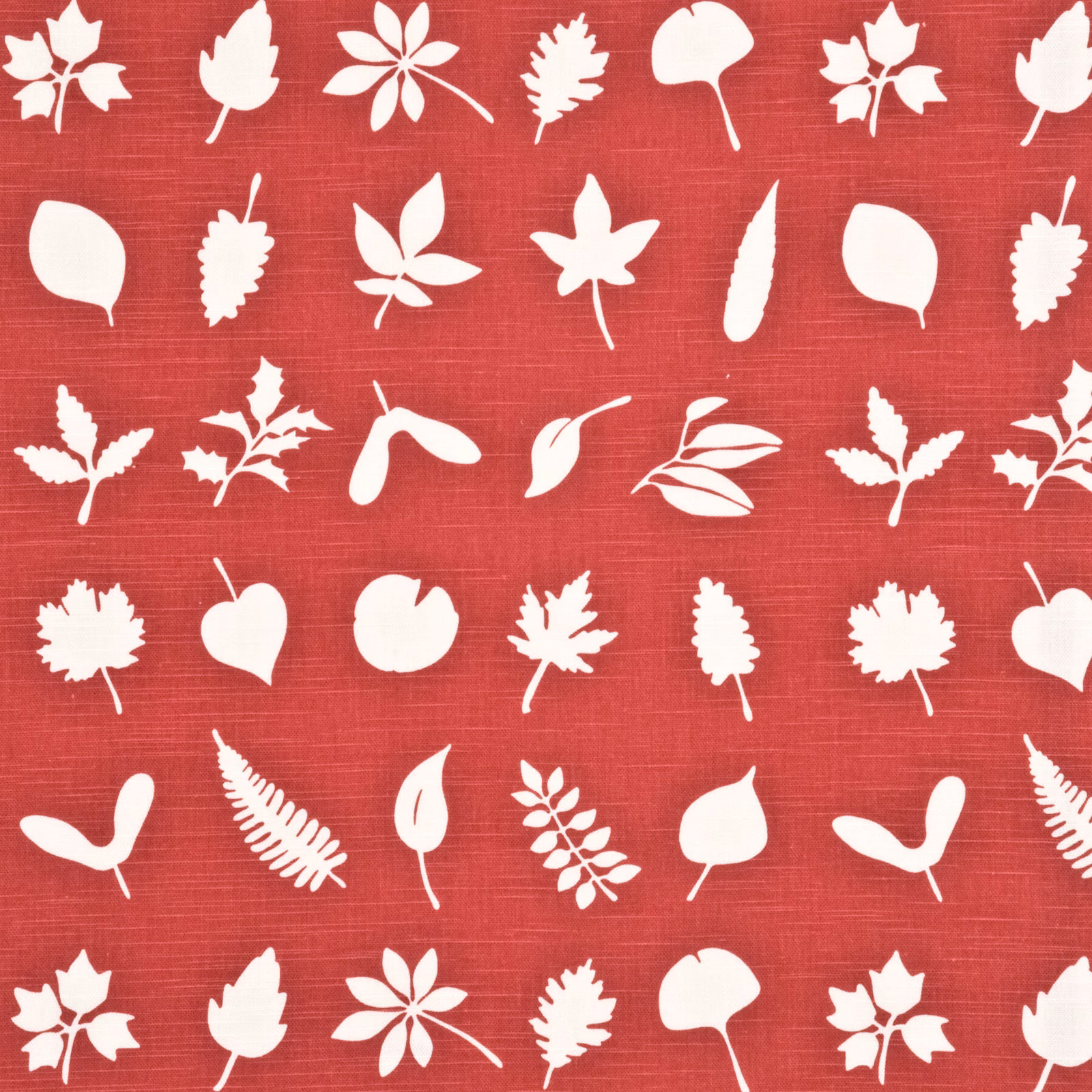 Warm red fabric with white silhouetted leaves, pods and flowers on a fine woven ground