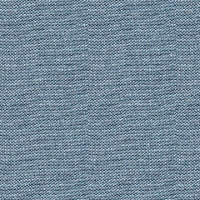 Close view of muted indigo blue fabric with a fine mottled crossweave