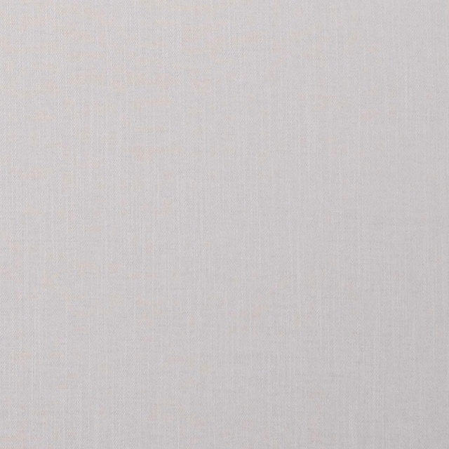 Close-up of soft ivory woven fabric with fine vertical striations and matte texture