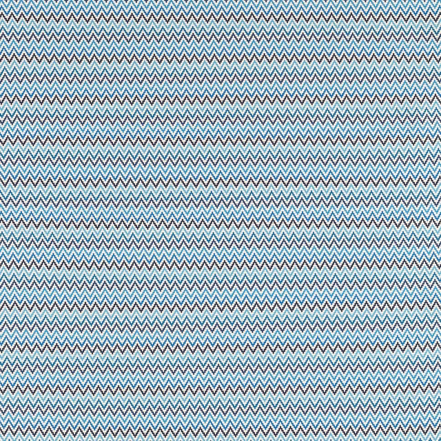 Close view of fine denim-blue and teal chevrons on a pale woven ground