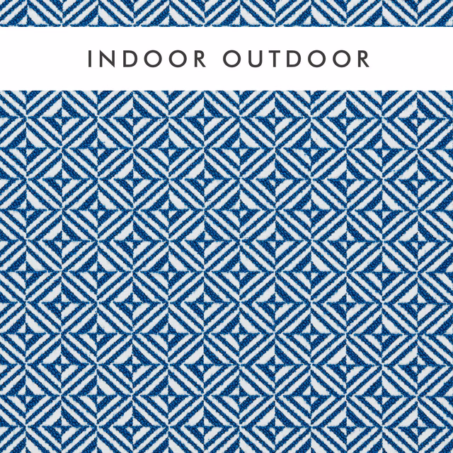 Cobalt blue and white geometric woven textile with crisp repeating diamond motifs