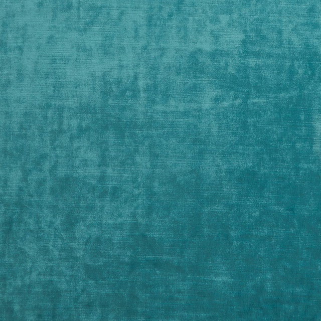 Close-up of mottled aqua teal upholstery fabric with softly brushed woven texture
