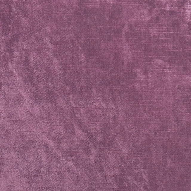 Mottled berry-purple upholstery textile with softly brushed tonal texture