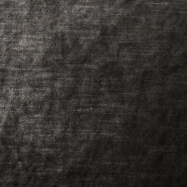 Close-up of deep charcoal fabric showing dense mottled horizontal texture