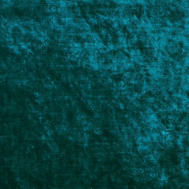 Deep jade-teal fabric with cloudy mottling and a softly lustrous textured surface