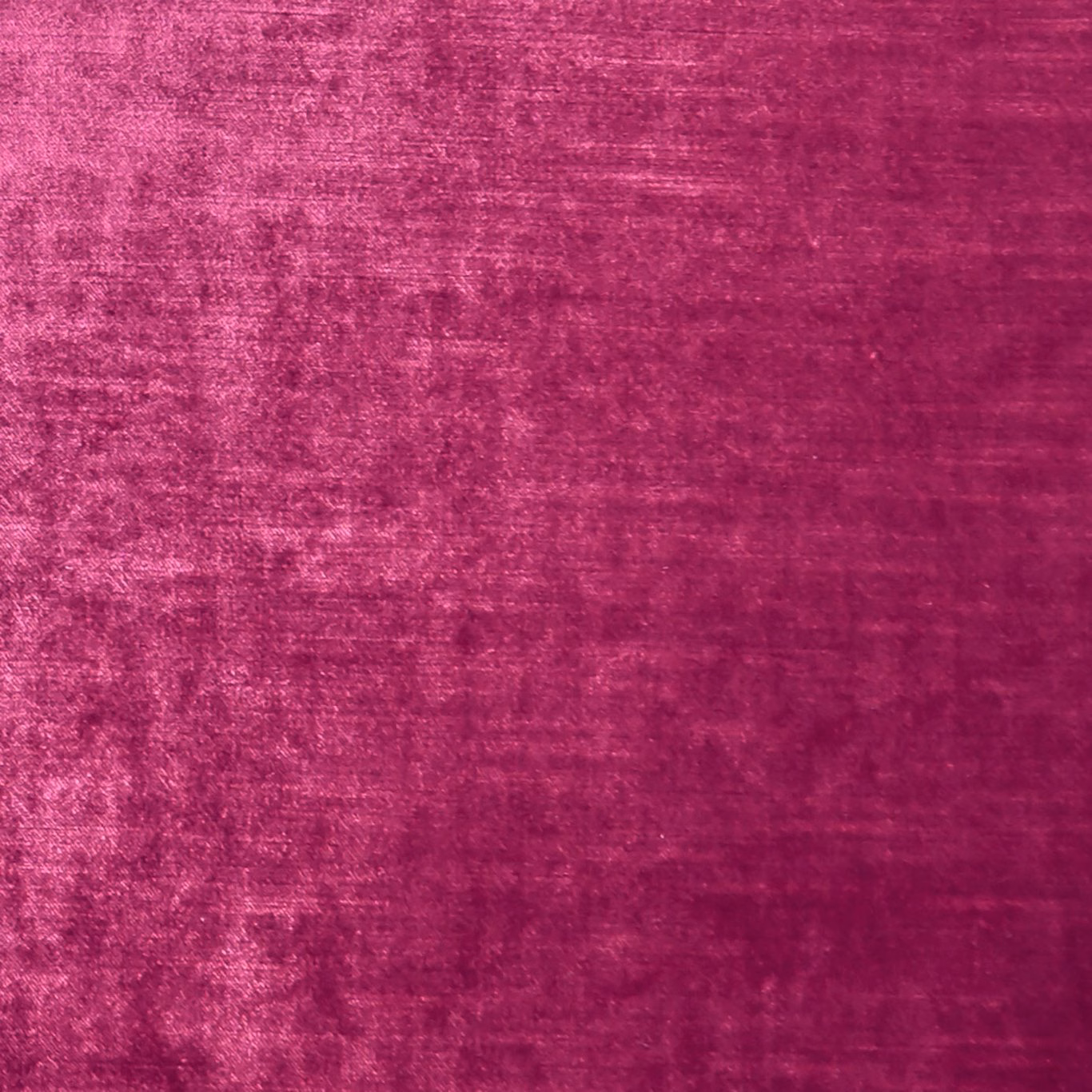 Deep magenta textile with a softly mottled, light-catching velvety pile