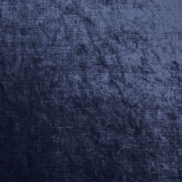 Deep midnight-blue textile with smoky mottling and a softly lustrous woven surface