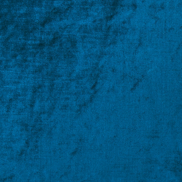 Deep peacock teal textile with cloudy mottling and a dense, softly textured surface