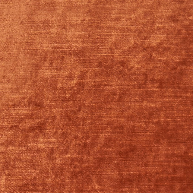 Burnt spice velvet-like textile with horizontal nap and softly mottled rust shading