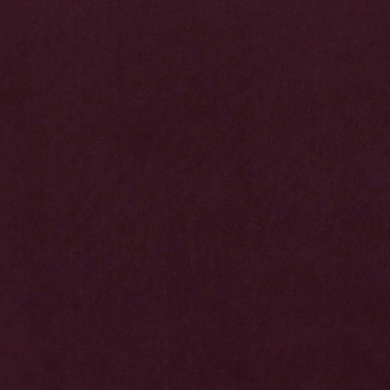 Deep bordeaux plain textile with a softly mottled, light-catching surface