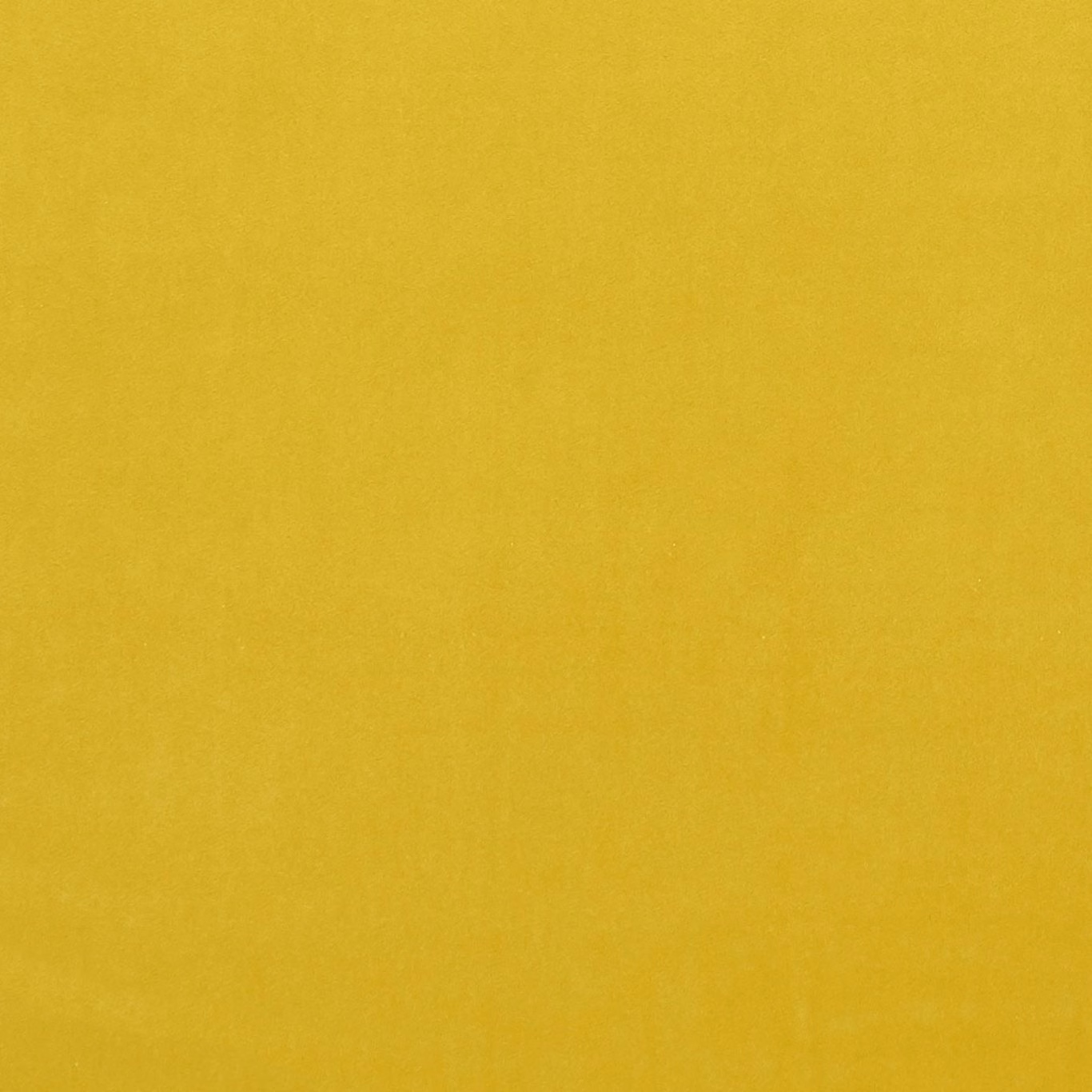 Close-up of saturated chartreuse fabric with a softly mottled, fine-textured surface