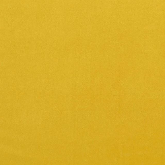 Close-up of saturated chartreuse fabric with a softly mottled, fine-textured surface