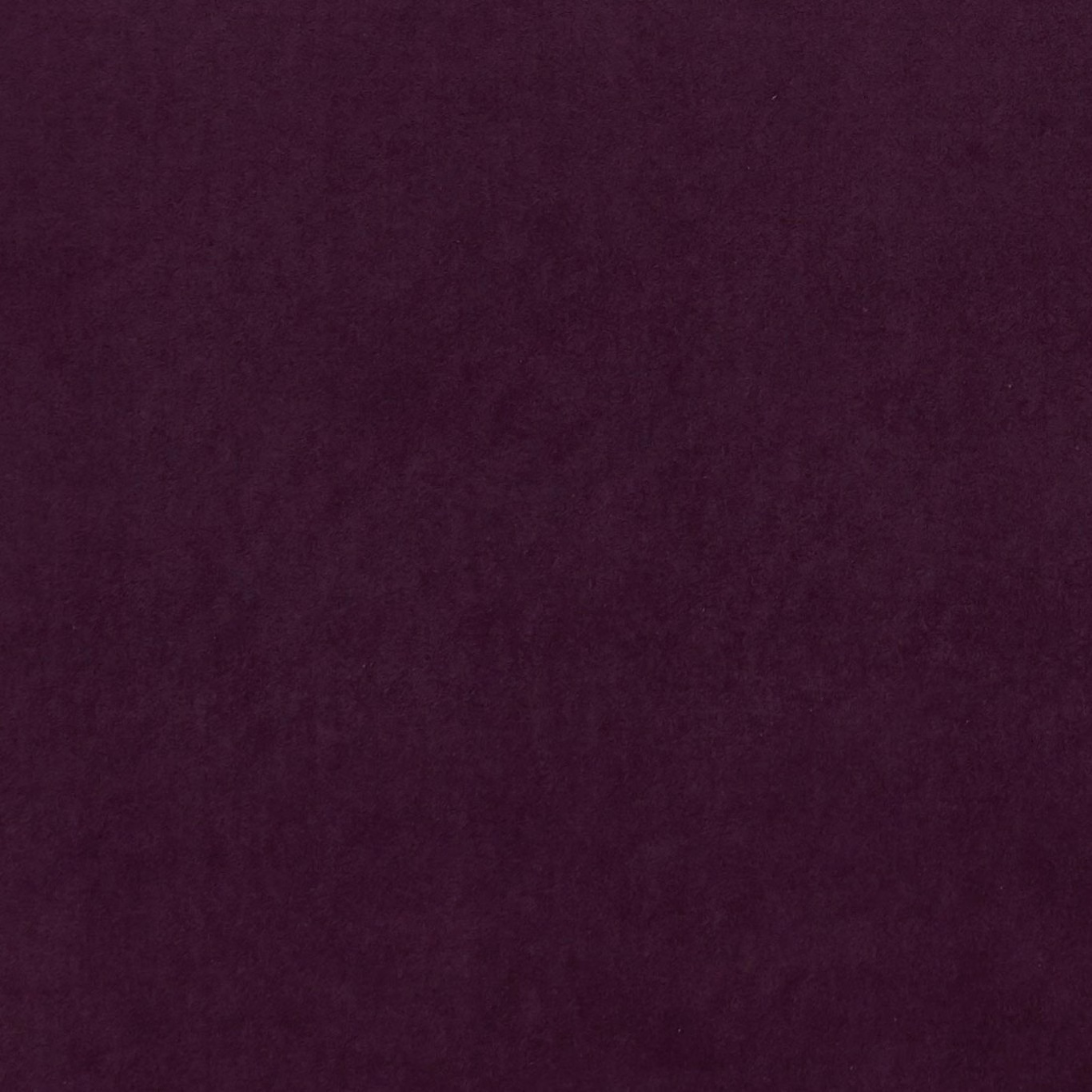 Deep cranberry-red textile with softly mottled plum texture in close-up