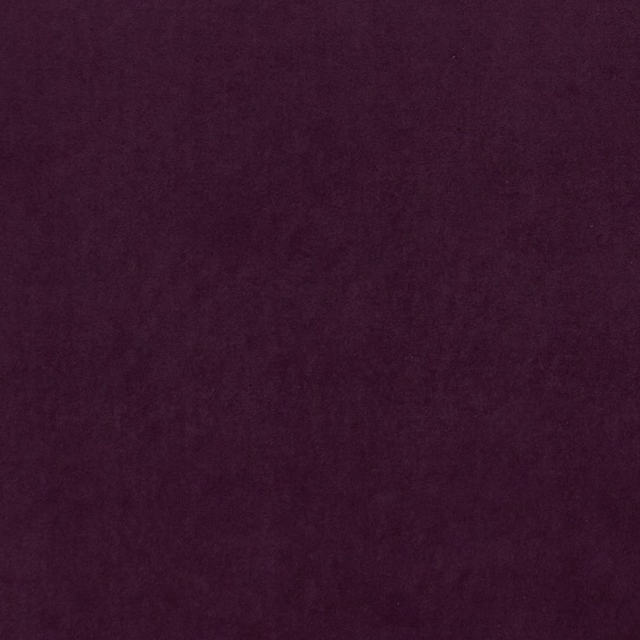 Deep cranberry-red textile with softly mottled plum texture in close-up