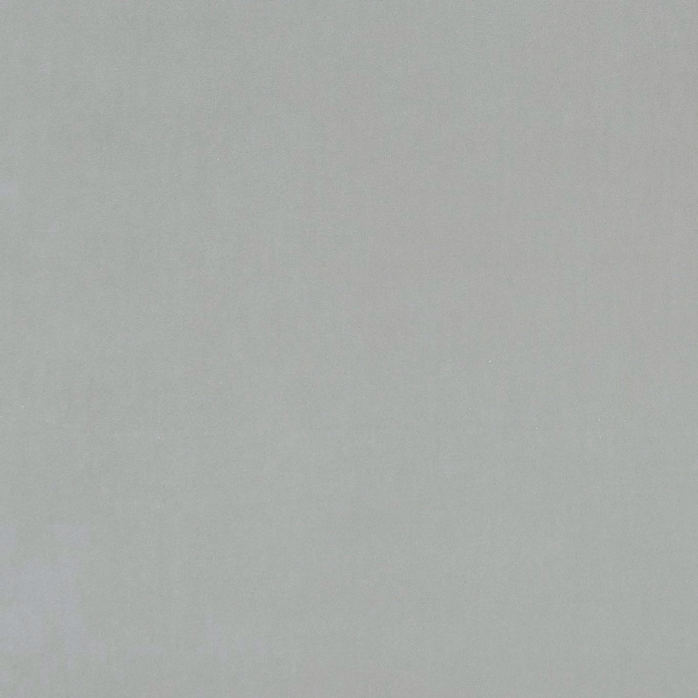 Close-up of cool dove-grey fabric with a soft, subtly mottled woven texture
