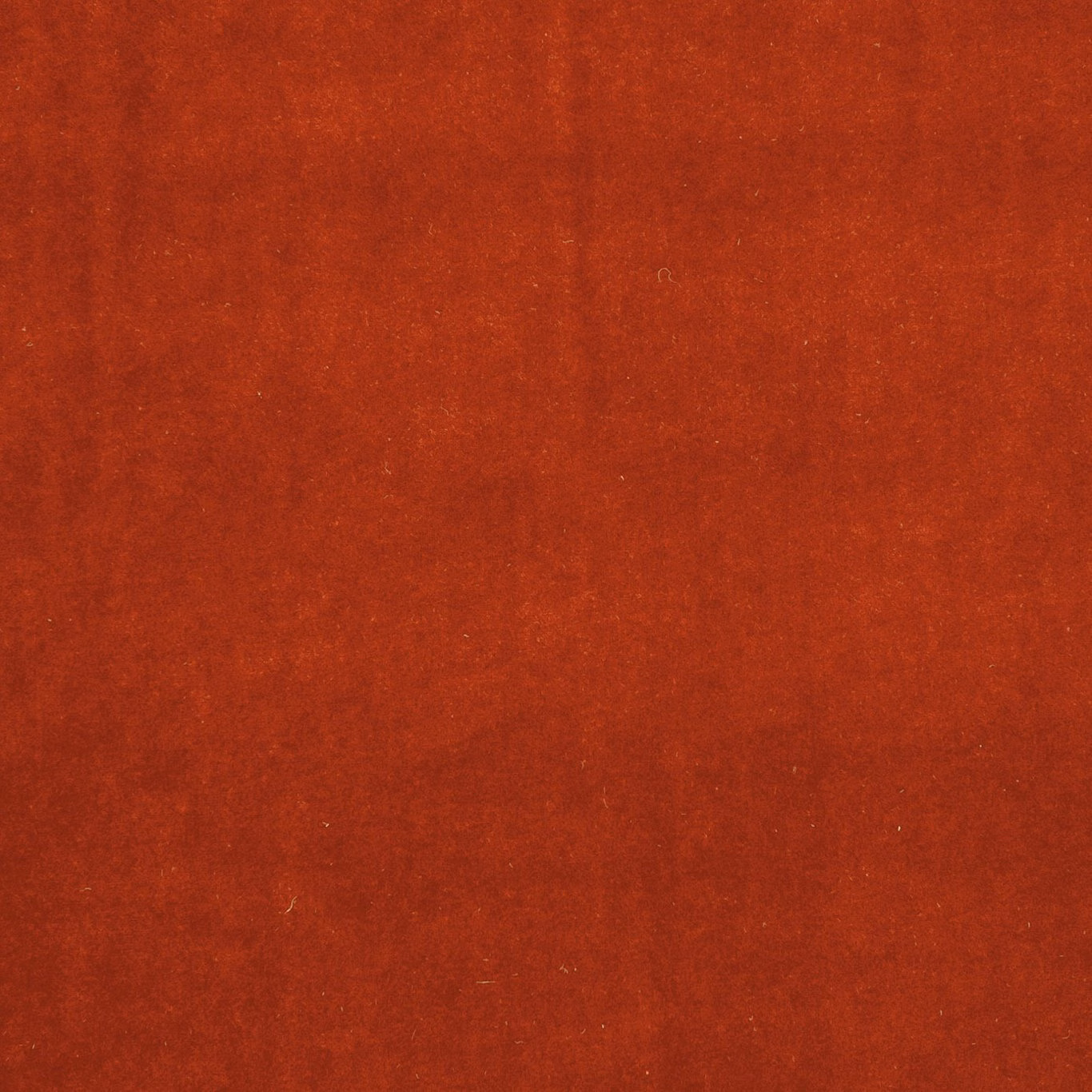 Burnt terracotta-red plain fabric with a softly mottled, brushed-looking surface