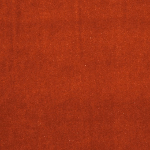 Burnt terracotta-red plain fabric with a softly mottled, brushed-looking surface