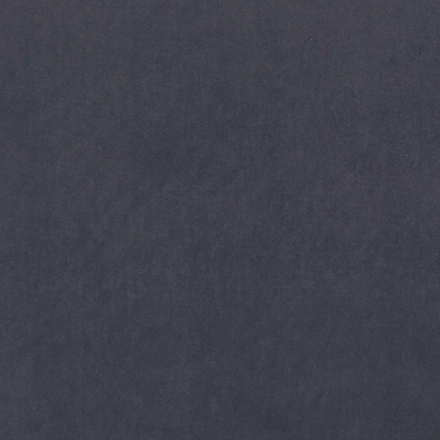 Close-up of dark graphite textile with subtle cloudy tonal variation and soft grain