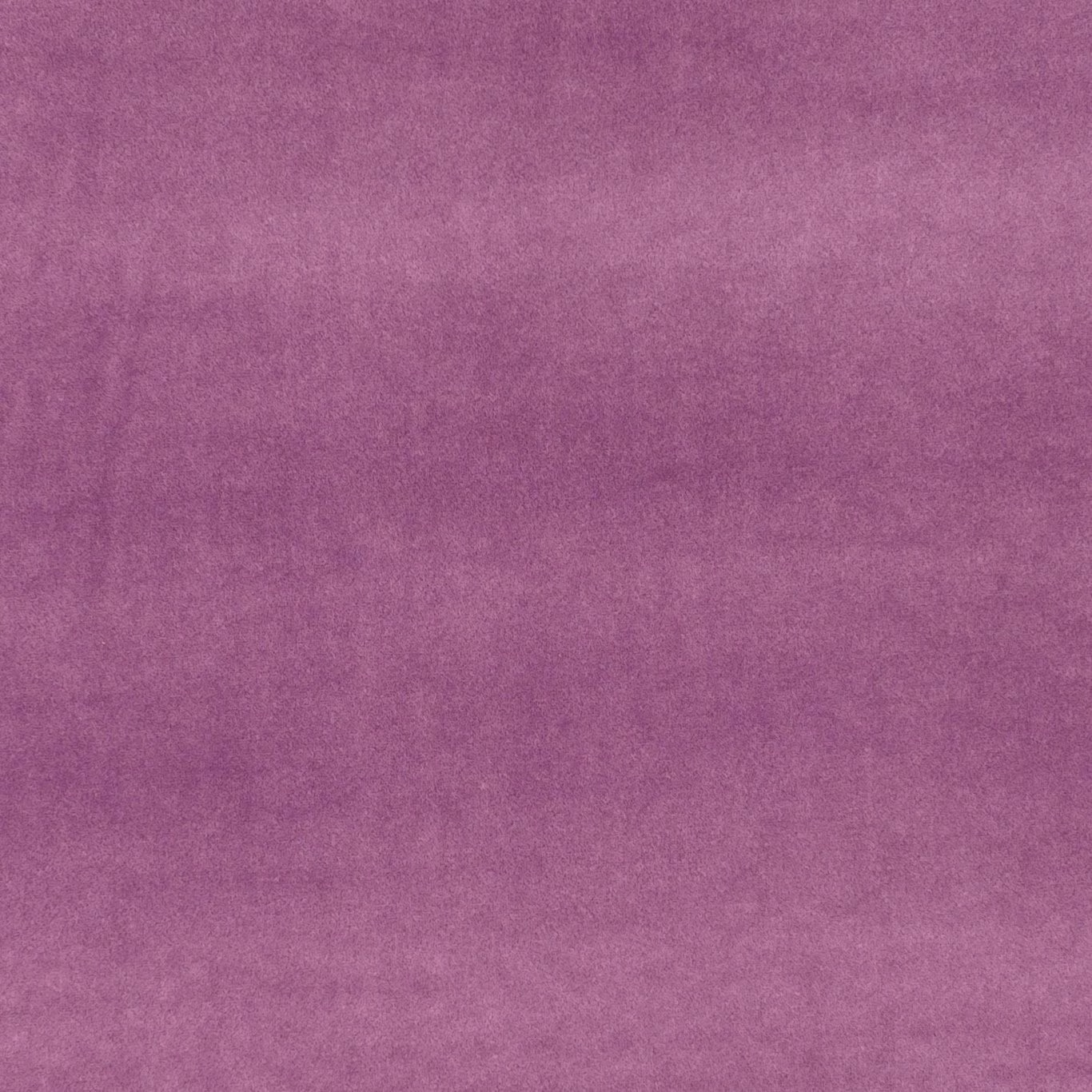 Close-up of heathered mauve-purple textile with softly mottled woven texture