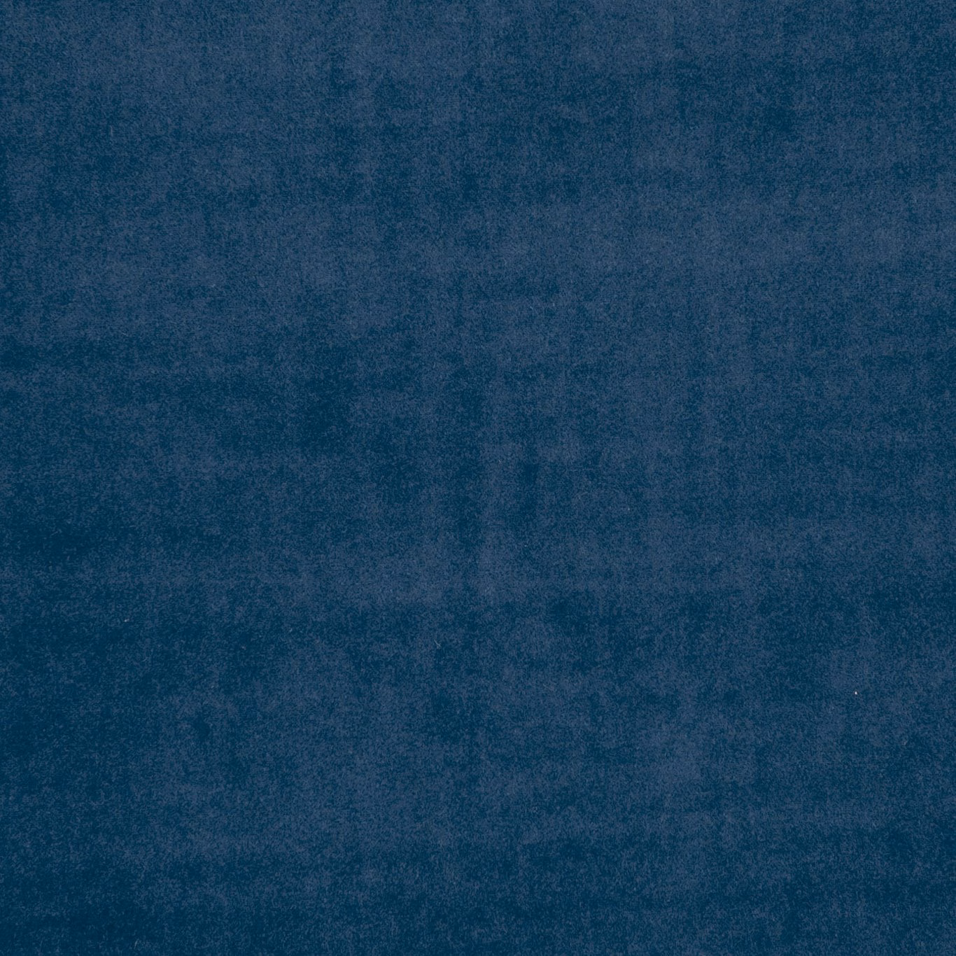 Deep indigo blue fabric with softly mottled, cloudy tonal surface texture